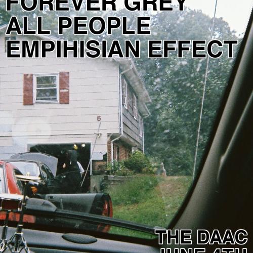 Photograph of a car sitting in a driveway, taken from the inside from the passenger seat